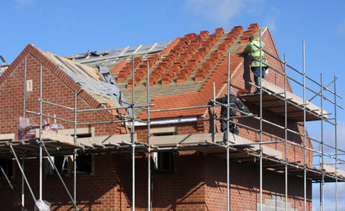 Roofer working on a residential roof
