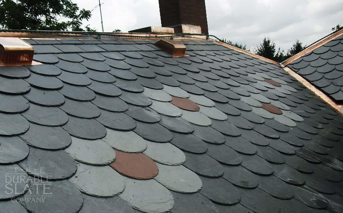 Slate roof installation in progress