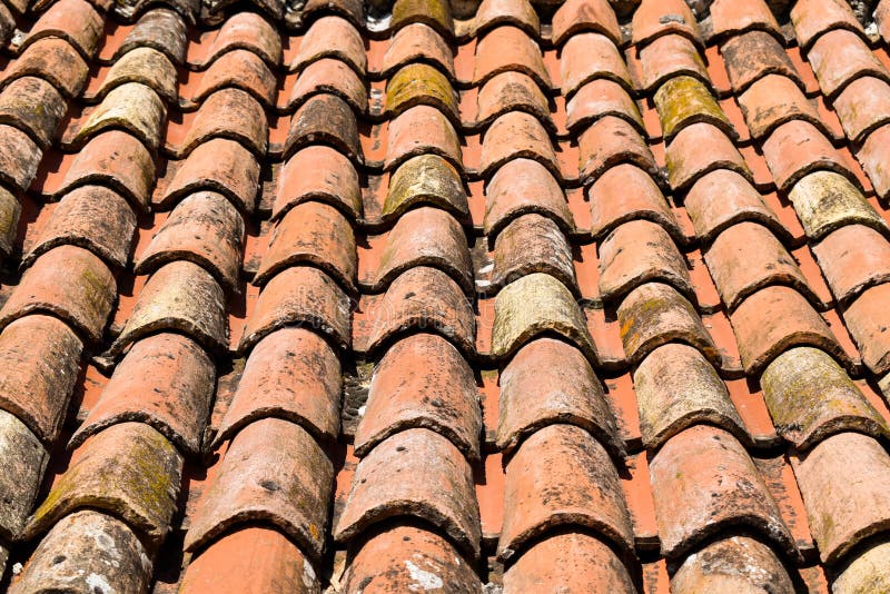 Close-up of clay roof tiles neatly laid in rows